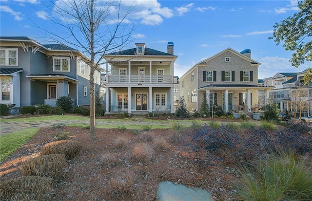 view of front of property with a balcony and covered porch