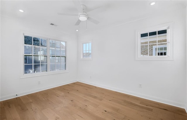 unfurnished room with ceiling fan and light hardwood / wood-style flooring