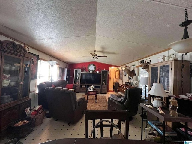 living room featuring a textured ceiling, a ceiling fan, and lofted ceiling