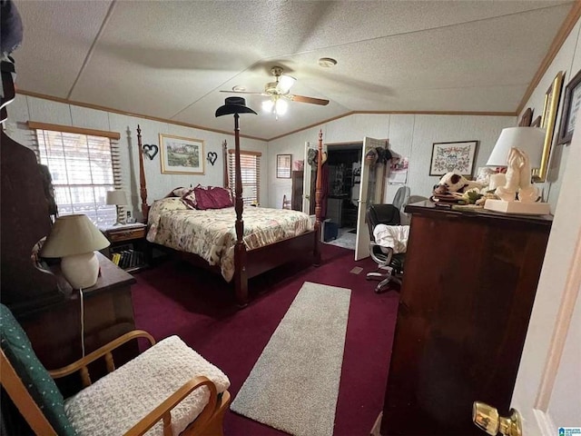 carpeted bedroom featuring ornamental molding, a textured ceiling, vaulted ceiling, and a ceiling fan