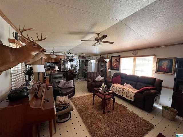 living room with light flooring, a ceiling fan, vaulted ceiling, and a textured ceiling