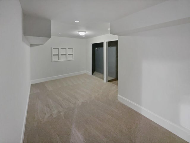 unfurnished room featuring recessed lighting, baseboards, and light colored carpet