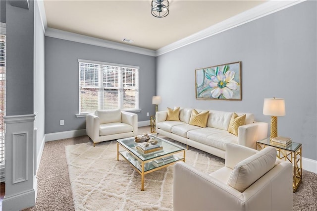 living area with baseboards, visible vents, crown molding, and carpet flooring