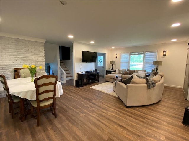 living area featuring stairs, baseboards, wood finished floors, and recessed lighting