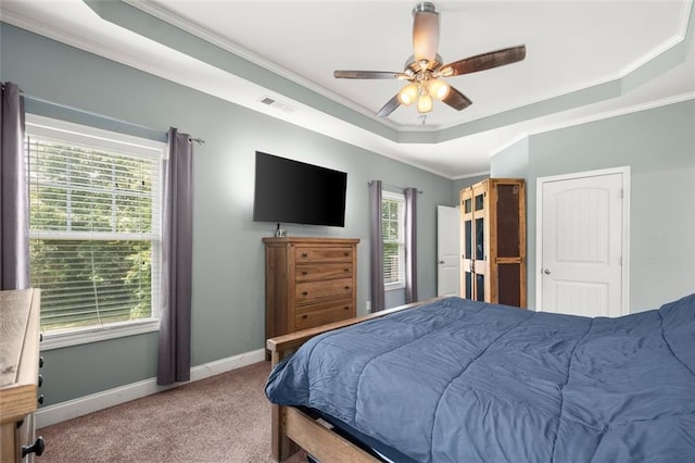 bedroom featuring carpet flooring, ceiling fan, and multiple windows