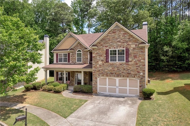 craftsman inspired home with an attached garage, stone siding, a front yard, a chimney, and driveway