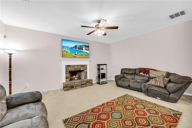living area with ceiling fan, visible vents, baseboards, and carpet