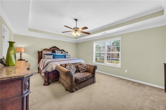 bedroom with crown molding, a raised ceiling, visible vents, and light carpet