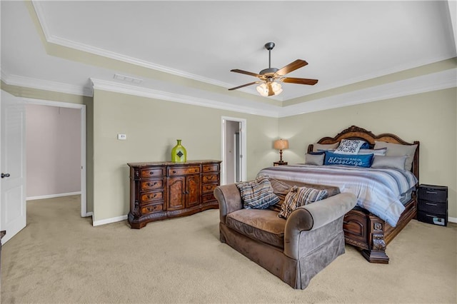 carpeted bedroom featuring baseboards, a tray ceiling, and visible vents