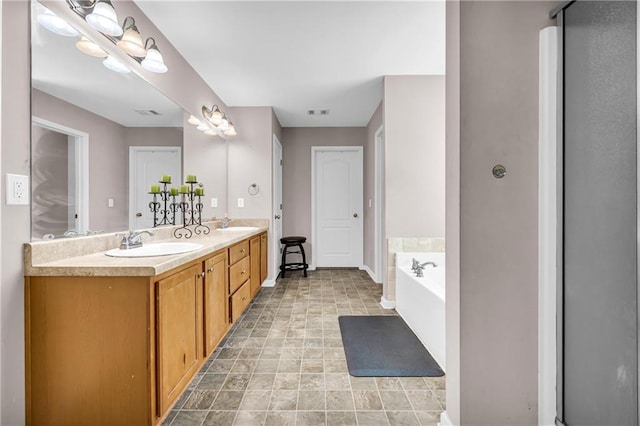 full bathroom featuring double vanity, a sink, a garden tub, and visible vents