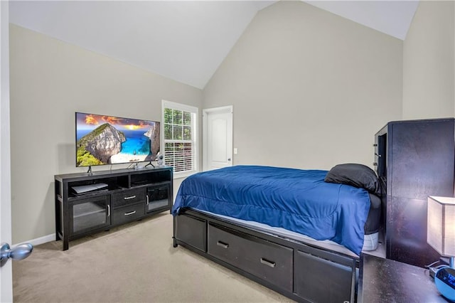 bedroom featuring carpet floors, baseboards, and high vaulted ceiling