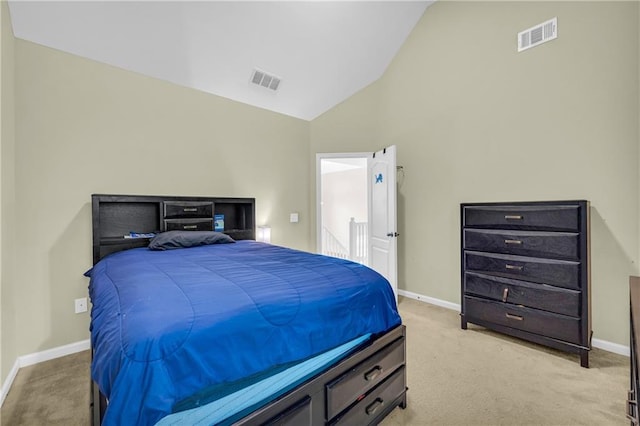 bedroom with visible vents, baseboards, and light carpet