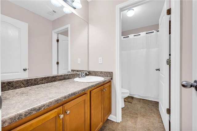 bathroom with tile patterned flooring, vanity, toilet, a shower with shower curtain, and visible vents