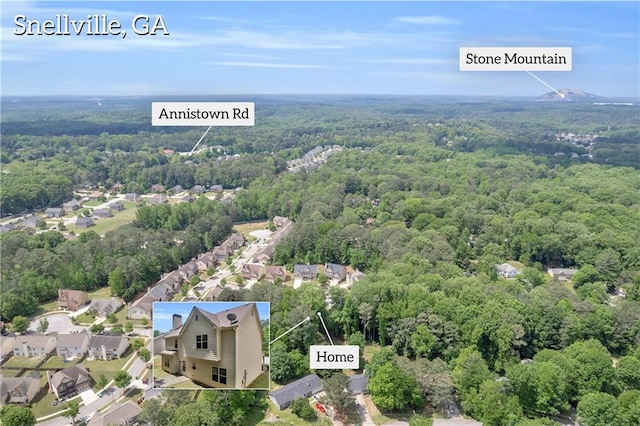aerial view with a residential view and a wooded view