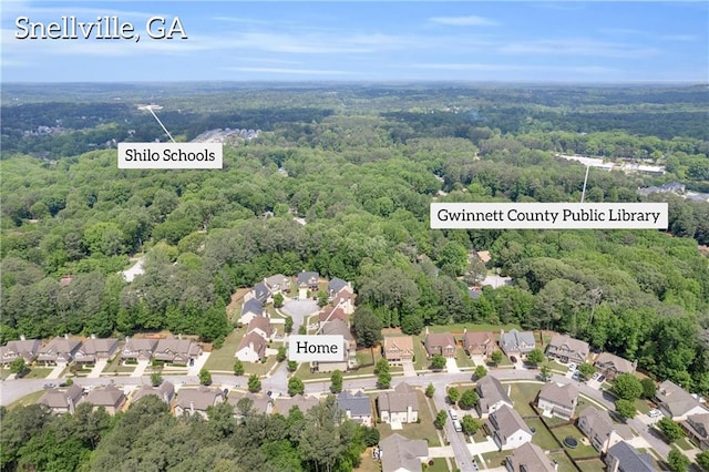 bird's eye view with a residential view and a wooded view