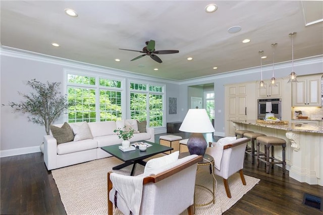 living room featuring crown molding, ceiling fan, and dark wood-type flooring