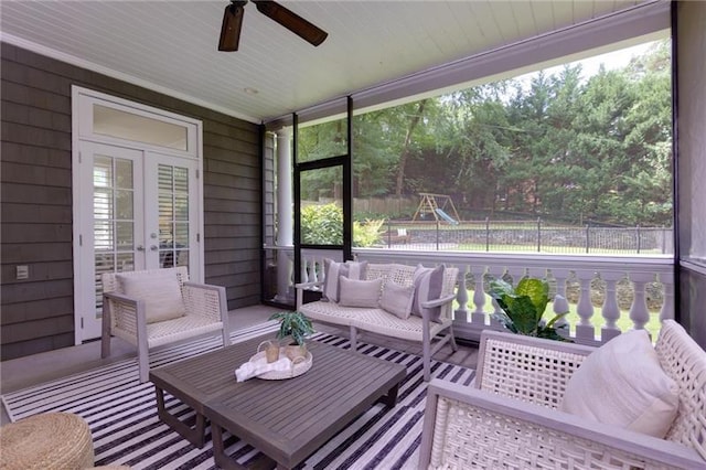 sunroom / solarium with ceiling fan and french doors