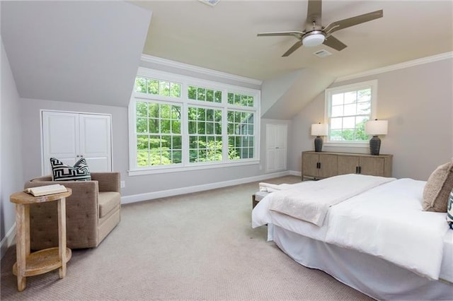 bedroom with ceiling fan, ornamental molding, light carpet, and lofted ceiling