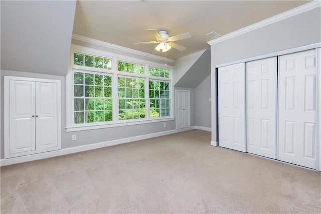 bonus room featuring ceiling fan and light carpet