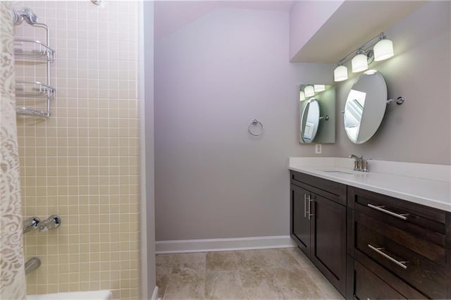 bathroom featuring vanity and tiled shower / bath combo