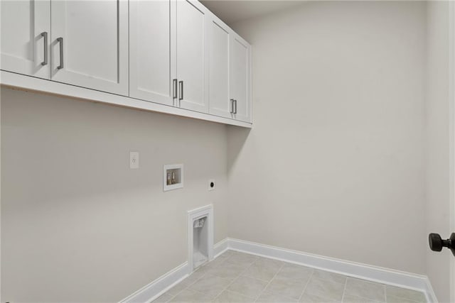 washroom with hookup for an electric dryer, cabinets, and hookup for a washing machine