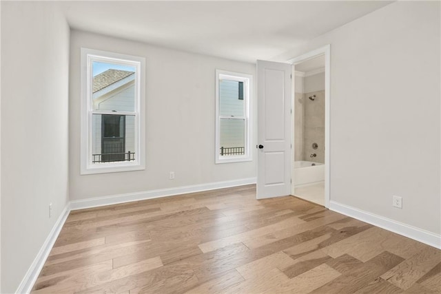 spare room with light hardwood / wood-style floors