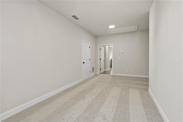 spare room with light carpet