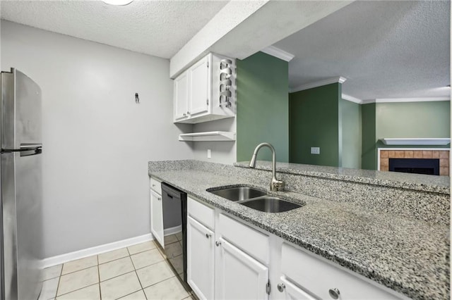 511 Barrington Hills Dr, Atlanta, GA 30350 - kitchen with a sink, freestanding refrigerator, dishwasher, a textured ceiling, and light stone countertops