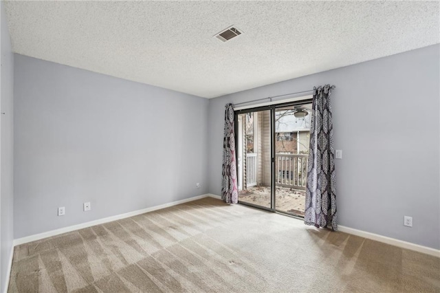 511 Barrington Hills Dr, Atlanta, GA 30350 - spare room with carpet floors, a textured ceiling, and baseboards