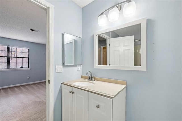 511 Barrington Hills Dr, Atlanta, GA 30350 - bathroom with vanity, a textured ceiling, and baseboards