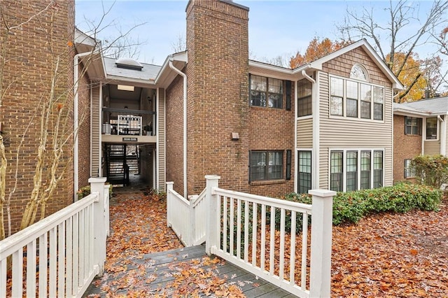 511 Barrington Hills Dr, Atlanta, GA 30350 - view of side of property with a chimney and brick siding
