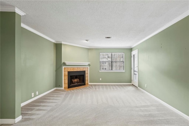 511 Barrington Hills Dr, Atlanta, GA 30350 - unfurnished living room with ornamental molding, a textured ceiling, carpet floors, a tile fireplace, and baseboards
