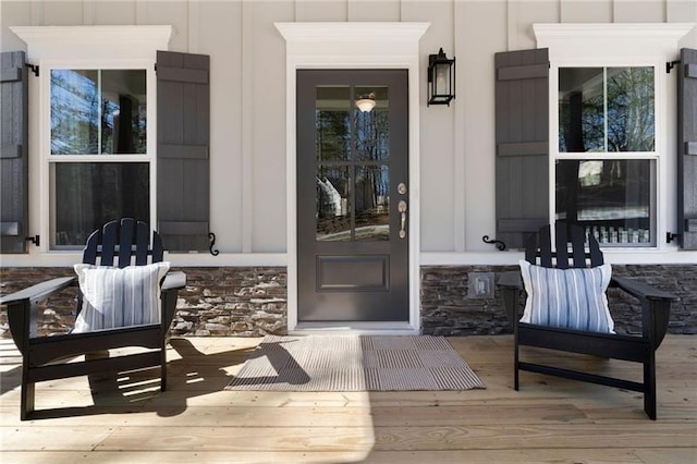 property entrance with stone siding