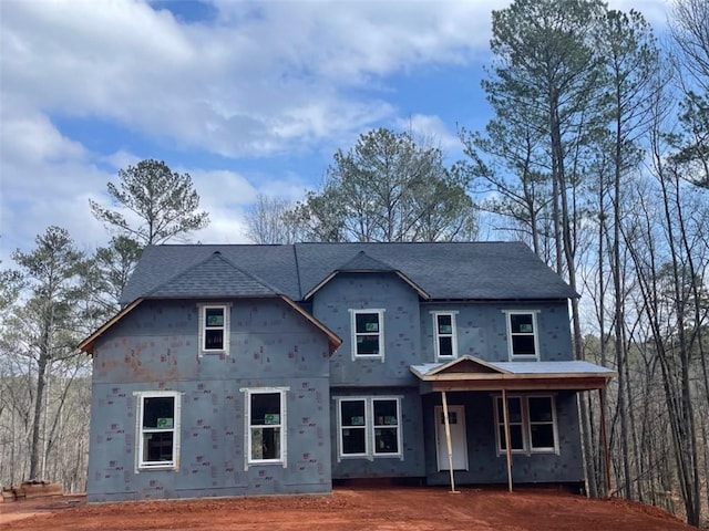 view of front of house featuring roof with shingles