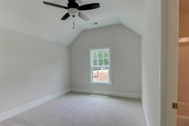 bonus room with carpet floors, visible vents, a ceiling fan, vaulted ceiling, and baseboards