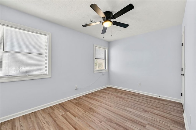 unfurnished room with light wood-type flooring and ceiling fan