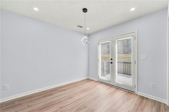 interior space featuring french doors and light hardwood / wood-style flooring