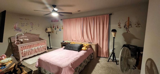 bedroom featuring light colored carpet and ceiling fan