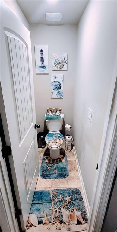 bathroom with tile patterned floors and toilet