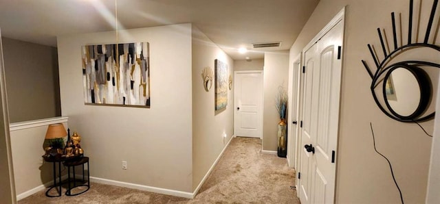 corridor with light colored carpet