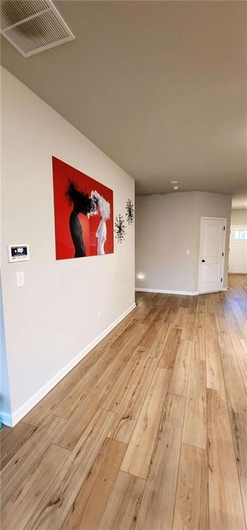 spare room featuring hardwood / wood-style flooring