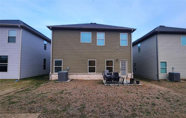 rear view of house featuring cooling unit and a patio