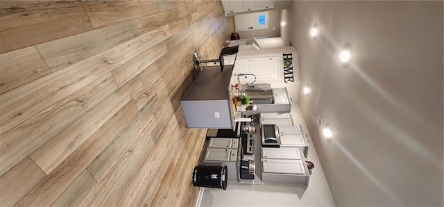 kitchen featuring white cabinets