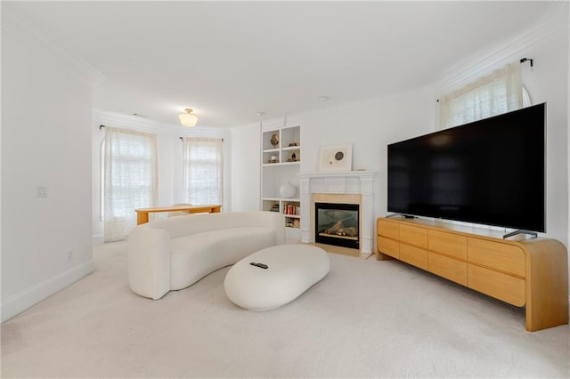 carpeted living room featuring ornamental molding and built in features