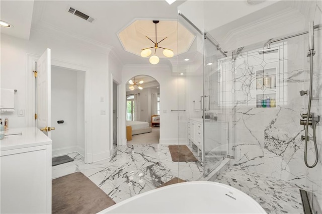 bathroom featuring crown molding, vanity, and separate shower and tub