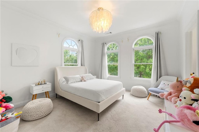 bedroom with carpet floors, crown molding, and a chandelier