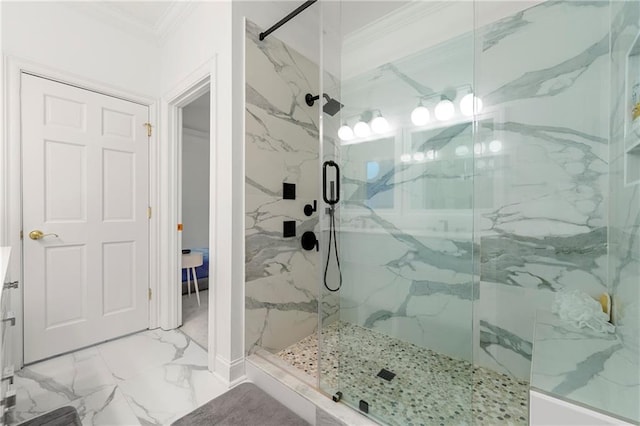 bathroom featuring vanity, a shower with shower door, and ornamental molding