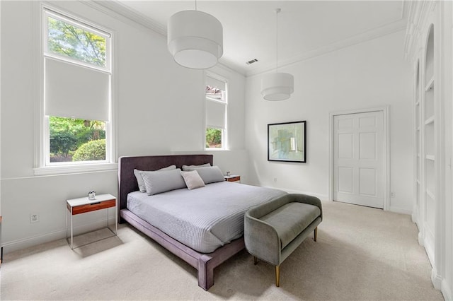 carpeted bedroom with multiple windows and crown molding