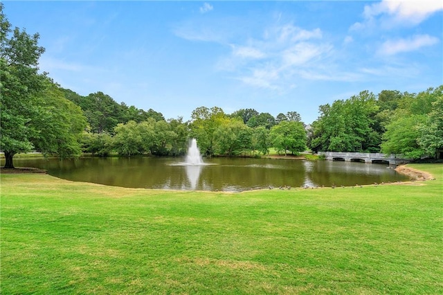 exterior space featuring a water view and a yard