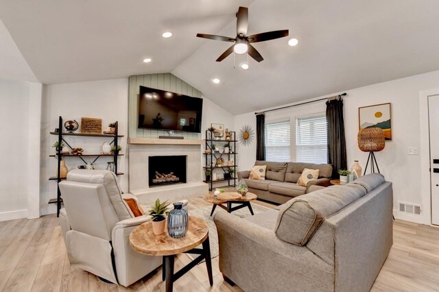 5441 E Main St, Flowery Branch, GA 30542 - living room featuring a ceiling fan, lofted ceiling, light wood-style floors, a large fireplace, and recessed lighting